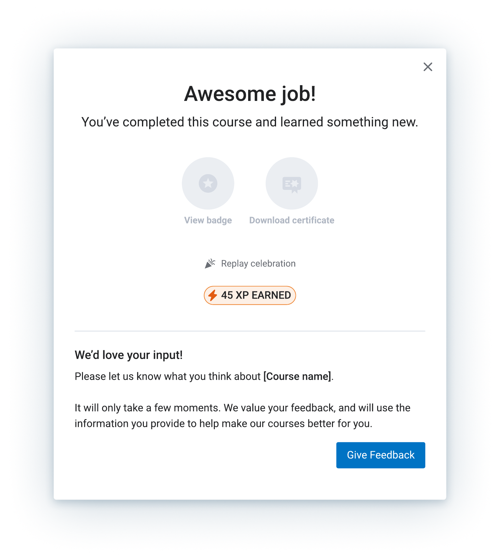 The completion moment — XP sits alongside the badge and certificate, never in front of them